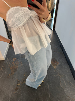 Jeans blu con borchie